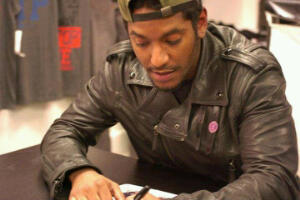 Lloyd signing autographs for his fans